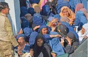  ?? (AFP) ?? Women gather outside the main gate of a football stadium following a stampede, in Afghanista­n’s Jalalabad on Wednesday