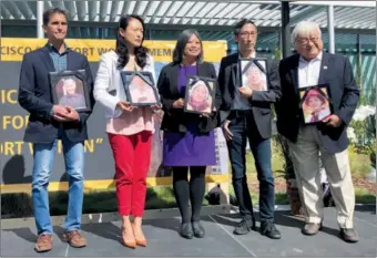  ?? LIA ZHU / CHINA DAILY ?? Former and current government officials, each holding a portrait of a late “comfort women” survivor, pay tribute at the “comfort women” memorial at a rally on Saturday in San Francisco.