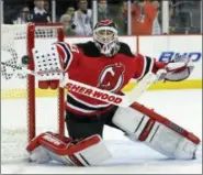  ?? BILL KOSTROUN — THE ASSOCIATED PRESS FILE ?? In this file photo, New Jersey Devils goaltender Martin Brodeur makes a save during the first period of a 2012 game against the Ottawa Senators in Newark, N.J. Brodeur was selected to the Hockey Hall of Fame, Tuesday.