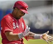  ?? ?? Christian Encarnacio­n-Strand, a prospect who raised hopes with a promising spring, could be part of the Reds’ ongoing rebuild.