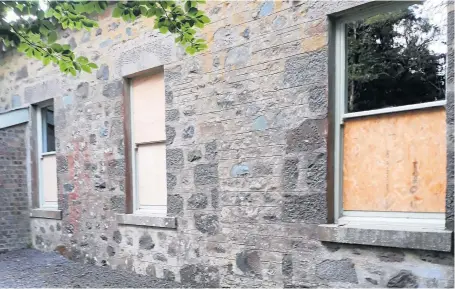  ?? ?? Upset Some of the broken windows at St Margaret’s Church in Comrie, which were smashed last week