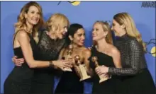  ?? PHOTO BY JORDAN STRAUSS — INVISION — AP ?? Laura Dern, from left, Nicole Kidman, Zoe Kravitz, Reese Witherspoo­n and Shailene Woodley pose in the press room with the award for best television limited series or motion picture made for television for “Big Little Lies” at the 75th annual Golden...