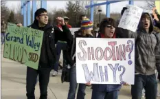  ?? HOLLYN JOHNSON/GRAND RAPIDS PRESS VIA AP ?? In this March 13, 2009 file photo, students protest the shooting of an unarmed Grand Valley State University student in the “Free Speech Zone” at Grand Valley State University in Allendale, Mich.