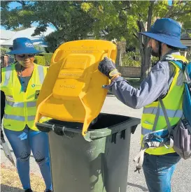  ?? ?? Mosman Park inspectors check a resident’s bin.