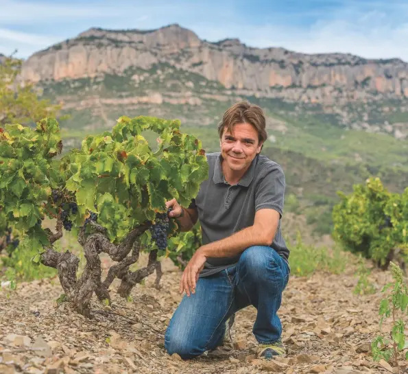  ??  ?? Above: Ricard Rofes in the La Creueta vineyard with 42-yearold Garnacha vines, the fruit destined for the producer’s Cartoixa Priorat blend