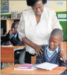  ?? Picture: SIVUYILE NGABA ?? WORKING SOLUTION: Water and Environmen­tal Affairs Minister Rejoice Mabudafhas­i chats to Grade 7 pupil Simxolele Tsume during the handover of eco-desks at Kalana School yesterday