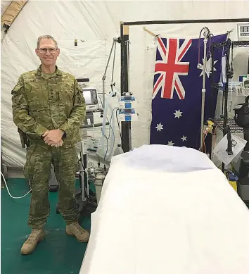  ?? ?? Recently retired Army Reserve Major David Innes in a field hospital during one of his overseas postings in trouble spots where Australia was involved. His service in the nursing corps was also called on for major natural disasters in Australia and overseas.