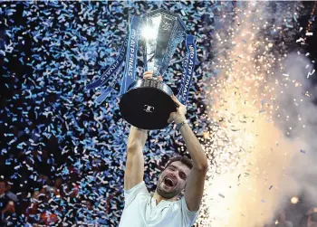  ??  ?? Grigor Dimitrov celebrates winning the men’s singles final against David Goffin in the ATP World Tour Finals tennis tournament at the O2 Arena in London on Sunday. Dimitrov won 7- 5, 6- 4, 6- 3. —