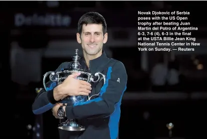  ??  ?? Novak Djokovic of Serbia poses with the US Open trophy after beating Juan Martin del Potro of Argentina 6-3, 7-6 (4), 6-3 in the final at the USTA Billie Jean King National Tennis Center in New York on Sunday. — Reuters