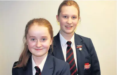  ??  ?? ●● Alice Warrington, 11, (left) and Elysia Wild, 12, were among the pupils from Whitworth Community High School to visit Anglo Recycling and learn more about the company’s green ethos