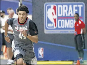  ?? CHARLES REX ARBOGAST / AP ?? North Carolina forward Justin Jackson runs in the sprint drill at the NBA draft combine last month in Chicago before auditionin­g for the Hawks.