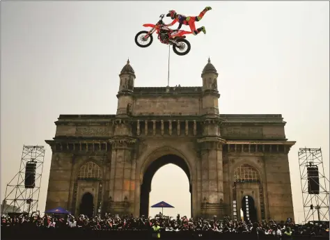  ?? REUTERS ?? Alexey Kolesnikov of Russia performs during the freestyle motocross games Red Bull FMX Jam at the Gateway of India in Mumbai on Saturday.