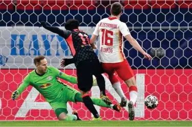  ?? Associated Press ?? ↑
Liverpool’s Mohamed Salah (centre) scores a goal against RB Leipzig during their Champions League match on Wednesday.