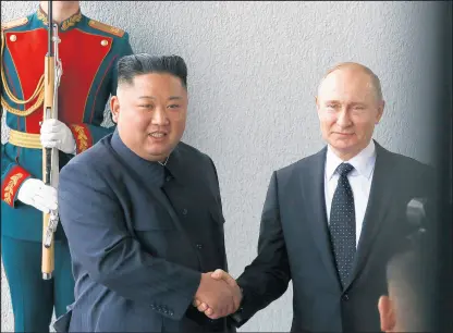  ?? ANDREY RUDAKOV/BLOOMBERG NEWS ?? North Korean leader Kim Jong Un shakes hands with Russian President Vladimir Putin at their summit meeting in Russia on April 25.