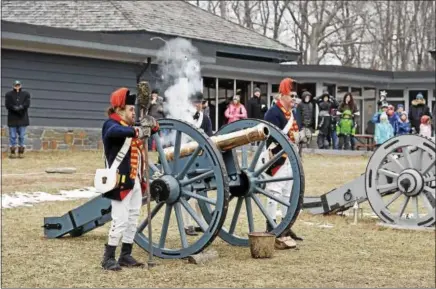  ?? FILE PHOTO ?? Visitors look on as re-enactors fire a canon at the Saratoga Battlefiel­d during the 21st annual Frost Faire.