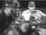  ?? AP/PATRICK SEMANSKY ?? St. Louis Manager Mike Matheny looks on in the seventh inning of the Cardinals’ 11-2 victory over Baltimore on Friday night, the team’s second victory in its last seven games.