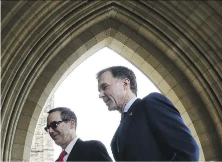  ?? SEAN KILPATRICK/THE CANADIAN PRESS ?? Finance Minister Bill Morneau, right, meets with U.S. Treasury Secretary Steve Mnuchin in Ottawa on Friday. “I think whatever we do, our objective is to make sure that (NAFTA) is positive for the U.S. economy and positive for the Canadian economy ...”...