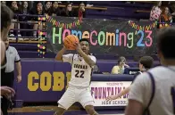  ?? The Sentinel-Record/Lance Porter ?? Senior guard Taten Smith (22) looks to pass in a basketball game for Fountain Lake. The Cobras defeated Mena 65-27 for basketball homecoming on Jan. 13, at Bass Gymnasium.