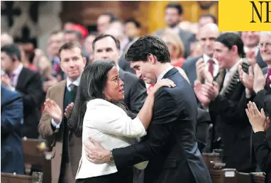  ?? JUSTIN TANG / THE CANADIAN PRESS ?? Prime Minister Justin Trudeau is embraced by Justice Minister Jody Wilson-Raybould after delivering a speech Wednesday on the recognitio­n and implementa­tion of Indigenous rights.