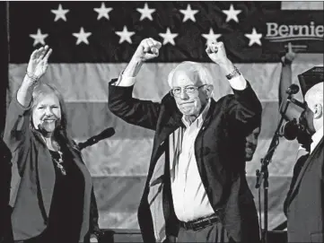  ?? JOHN J. KIM/CHICAGO TRIBUNE PHOTOS ?? Presidenti­al candidate Sen. Bernie Sanders and his wife, Jane, acknowledg­e supporters after speaking in Cedar Rapids, Iowa.