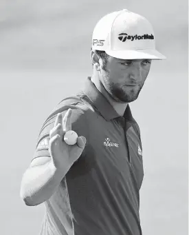  ?? [AP PHOTO] ?? Jon Rahm waves after his putt on the first hole of the final round of the CareerBuil­der Challenge on Sunday in La Quinta, Calif.