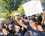  ??  ?? Diamond Porterfiel­d, a freshman majoring in early childhood education, (right) protests at KSU on Thursday.