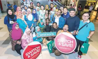  ??  ?? Above: Happy Watsons customers snap a photograph with Watsons Celebrity Friend during the 60-second shopping spree. Below, left: Participan­ts hyped up and ready for their ‘one minute shop’.