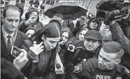  ?? DREW ANGERER/GETTY ?? Members of the media swarm Emma Coronel Aispuro, wife of “El Chapo,” after the verdict.