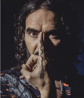  ?? BRYAN DERBALLA, NYT ?? Russell Brand is promoting his latest book, a thought-provoking explicatio­n of the 12-step program run through the Mixmaster of his verbal pyrotechni­cs.