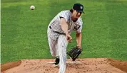  ?? ?? New York Yankees starting pitcher Gerrit Cole delivers during the second inning against the Philadelph­ia Phillies on Aug. 3, 2020, at Yankee Stadium in New York. Cole has been placed on the 60-day injured list with right elbow inflammati­on.