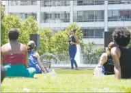  ?? Matthew Brown / Hearst Connecticu­t Media ?? Samantha Alemseghed, of Stamford, 25, recites a spoken-word poem she wrote to a crowd of 30 attending the Justice for Brunch Mental Wellness in the Black Community event at Harbor Point’s Commons Park on Saturday in Stamford.