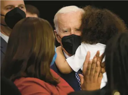  ?? SCOTT OLSON/GETTY ?? A boy whose father was one of 10 people killed in a mass shooting in Buffalo, N.Y., hugs President Joe Biden on Tuesday.