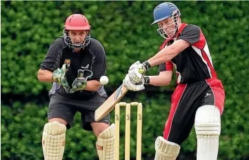  ?? JOHN HAWKINS/ STUFF ?? Waikoikoi batsman Liam McFaul in action with Southland Barbarians wicketkeep­er Geoff Folster at the ready, during the twenty20 Super League semifinal game at Queens Park Invercargi­ll on Sunday.