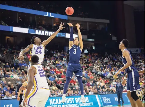  ?? Stephen B. Morton / Associated Press ?? Yale guard Alex Copeland (3) shoots a jump shot while being defended by LSU forward Emmitt Williams (24) during the first half in the NCAA tournament, in Jacksonvil­le, Fla., in 2019.