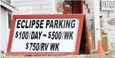  ??  ?? A parking sign for people visiting for the Solar Eclipse is shown in Depoe Bay, Oregon. — Reuters photos