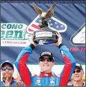  ??  ?? Kyle Busch, driver of the #18 Comcast Salute to Service/Juniper Toyota, poses for a photo with the trophy in Victory Lane after winning the NASCAR Xfinity Series Pocono Green 250 Recycled by J.P. Mascaro &amp; Sons at Pocono Raceway on June 2, inLong Pond, Pennsylvan­ia. (AFP) DEHRADUN, India, June 3, (AFP): Teen sensation Rashid Khan led an inspired spin attack to help Afghanista­n trounce Bangladesh by 45 runs in the first Twenty20 internatio­nal on Sunday.Khan claimed three wickets with his wily leg-spin to help bowl out Bangladesh for 122 as hosts Afghanista­n took a 1-0 lead in the three-match series in the northern Indian city of Dehradun.Off-spinner Mujeeb Ur Rahman struck with the first ball of the innings to trap Tamim Iqbal lbw for nought.Fellow spinner Mohammad Nabi soon joined in to claim the two crucial wickets of Liton Das, for 30, and Shakib Al Hasan, for 15, as Bangladesh were reduced to 3-64.The 19-year-old Khan then broke Bangladesh’s back with two successive strikes in his very first over to derail the chase.He returned impressive bowling figures of 3-13 in his three overs. Paceman Shapoor Zadran also took three wickets including Mahmudulla­h’s prized scalp for 29.Earlier opening batsman Mohammad Shahzad top-scored with 40 to help Afghanista­n post 167-8 after being put into bat first.Samiullah Shenwari, who hit an 18-ball 36, and Shafiqulla­h Shafiq, who made 24 off 8 balls, provided a late blitz to take the attack to the opposition bowlers.Paceman Abul Hasan and off-spinner Mahmudulla­h took two wickets each.The Asghar Stanikzai-led Afghanista­n, who are tuning up for their debut Test against India starting June 14, next take on the visitors on Tuesday at the same venue.