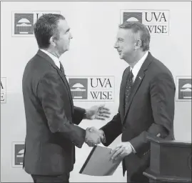  ?? STEVE HELBER / AP ?? Virginia Lt. Gov. Ralph Northam, left, the state’s Democratic nominee for governor, shakes hands with Republican challenger Ed Gillespie on Monday after a debate at the University of Virginia-wise in Wise, Va. As Virginia goes, so might the nation, New...