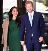  ??  ?? Britain’s Prince Harry, Duke of Sussex, right, and his wife Meghan, Duchess of Sussex attend the annual WellChild Awards in London. — AFP