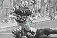  ?? Peter Aiken/Getty Images ?? Kansas State’s Deuce Vaughn, top, torched Missouri for 145 rushing yards and two TDs in Saturday’s win.