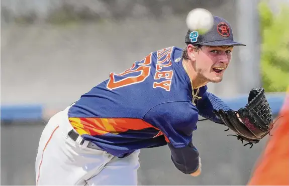  ?? Karen Warren/Staff photograph­er ?? Righthande­r Forrest Whitley is likely headed to Class AAA Sugar Land after showing improved command of his pitches in the Astros’ camp.