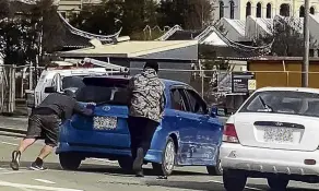  ?? PHOTO: SUPPLIED ?? Pandemoniu­m . . . A roadrage incident unfolds in broad daylight in Central Dunedin on Sunday.