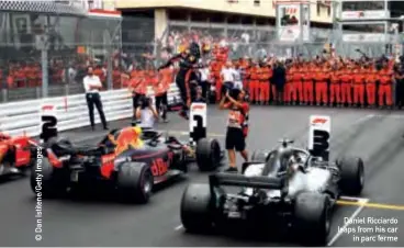  ??  ?? Daniel Ricciardo leaps from his car in parc ferme