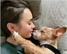  ?? ?? Best friends: Lily Collins said it was ‘love at first sight’ when she met pug-terrier cross, Redford in 2019