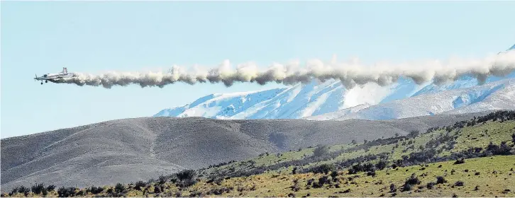  ?? PHOTO: STEPHEN JAQUIERY ?? Out she goes . . . James Allen, from Otago Airspread, spreads his 2tonne load of fertiliser in the Ida Valley yesterday.