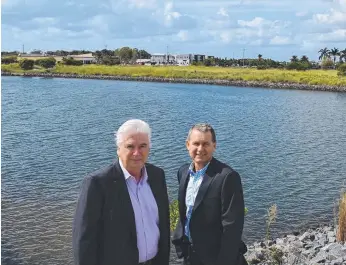  ??  ?? Geoff Lamb and Darell Irwin, from Colliers Internatio­nal, at the Marina Quays Blvd site.