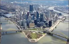  ?? Darrell Sapp/Post-Gazette ?? An aerial view of the Downtown Pittsburgh skyline and Point State Park with the Allegheny and Monongahel­a Rivers forming the Ohio on April 10, 2018.