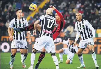  ?? ?? AC Milan’s Ibrahimovi­c (C) shoots and scores in a Serie A match against Udinese, Udine, Italy, Dec. 11, 2021.