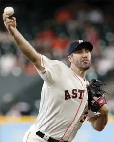  ?? AP PHOTO/MICHAEL WYKE ?? Houston Astros starting pitcher Justin Verlander throws against the San Francisco Giants during the first inning of a baseball game Wednesday in Houston.