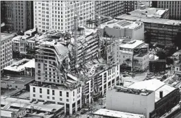  ?? GERALD HERBERT/AP ?? A constructi­on worker who survived the collapse of the Hard Rock Hotel’s constructi­on site in October in New Orleans was deported Friday to his native Honduras.