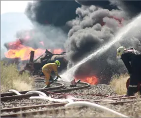  ??  ?? Intense… Firefighte­rs took on a defensive approach in fighting a large fire caused by the explosion of nine TransNamib fuel tanks.